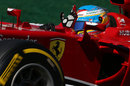 Fernando Alonso waves to the fans from behind the wheel on Saturday