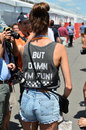 A fan shows off a personalised message before the race