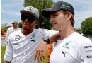 Lewis Hamilton and Nico Rosberg talk to TV cameras before the start of the race