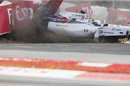 Felipe Massa smashes into the barrier after contact with Sergio Perez