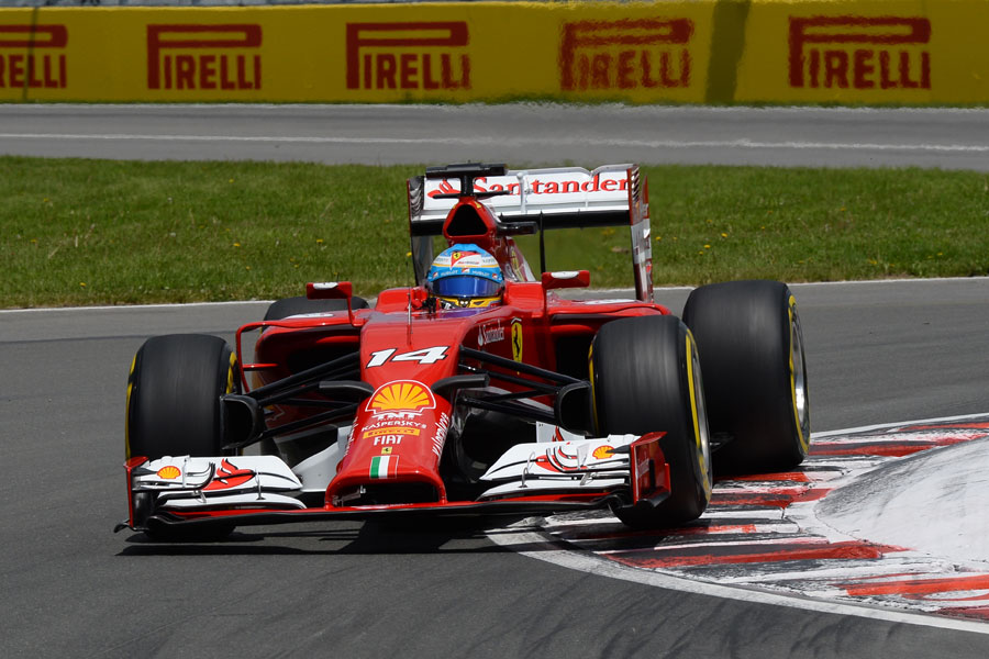 Fernando Alonso rounds the kerb