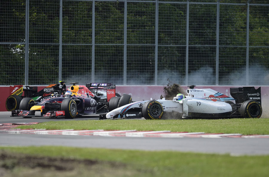 Sebastian Vettel narrowly avoids being collected by Felipe Massa after his collision with Sergio Perez