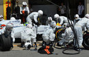 The Williams pit crew struggle to fit Felipe Massa's front left tyre