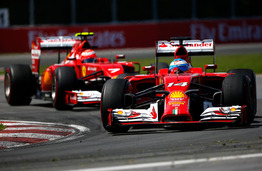Fernando Alonso leads Kimi Raikkonen on track
