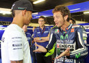 Lewis Hamilton is greeted by Valentino Rossi