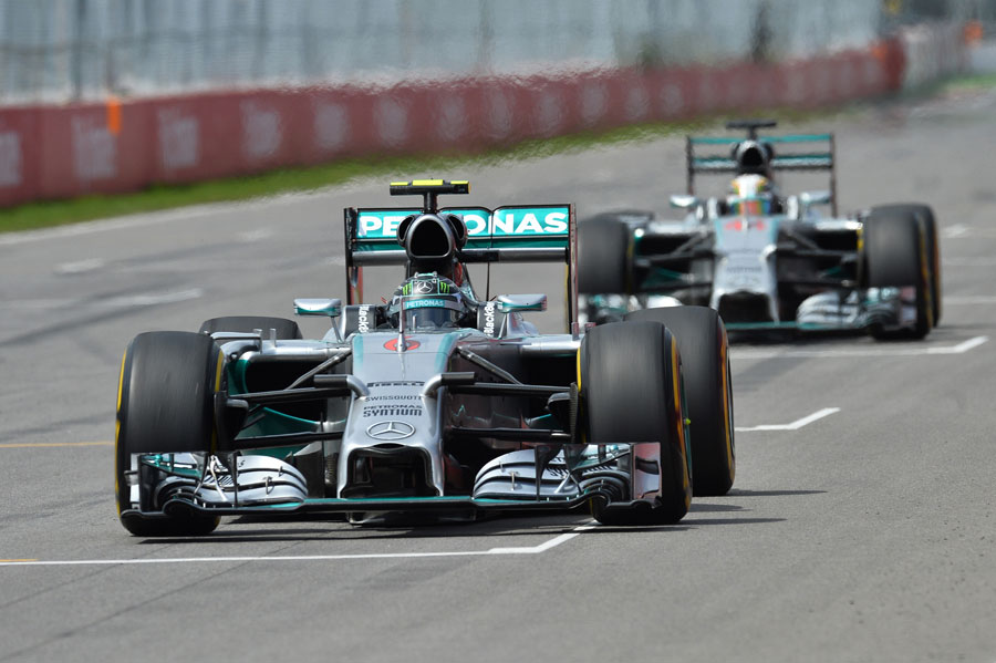 Nico Rosberg starts another lap with Lewis Hamilton in hot pursuit