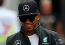 Lewis Hamilton walks through the paddock 