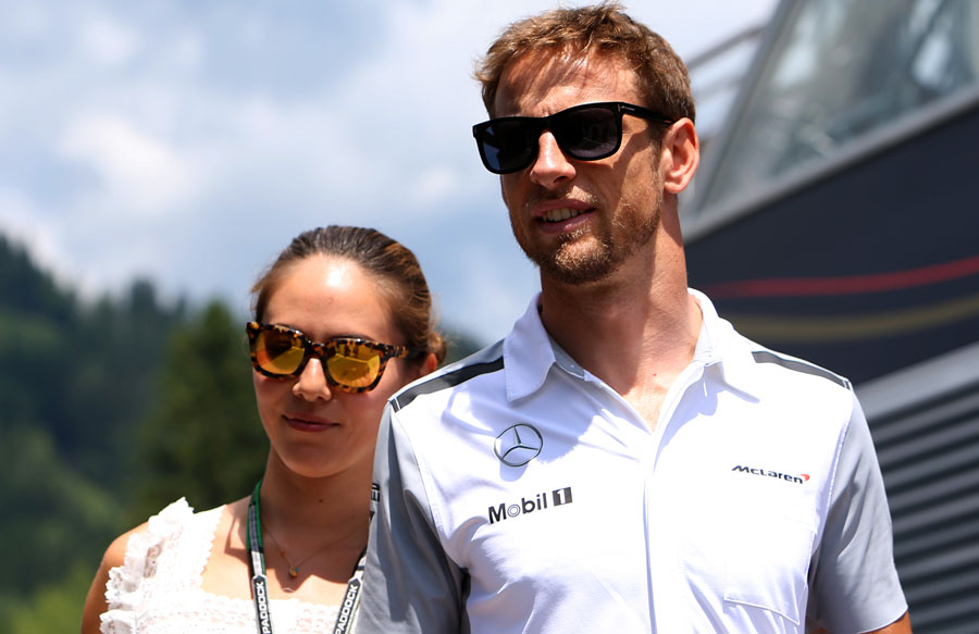 Jenson Button arrives at the paddock in Spielberg with fianee Jessica Michibata
