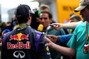 Daniel Ricciardo talks to the media, including Dan Knutson (right) who is attending his 500th grand prix weekend