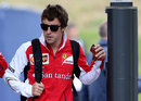 Fernando Alonso arrives in the paddock on Saturday morning