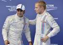 Felipe Massa is congratulated by team-mate Valtteri Bottas in parc ferme