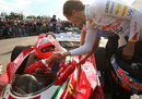 Sebastian Vettel wishes Niki Lauda luck before he heads out on a lap in his old Ferrari 312 T2