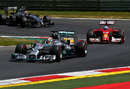 Lewis Hamilton leads Fernando Alonso and Kevin Magnussen through Turn 1