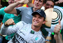 Nico Rosberg celebrates with his winner's trophy