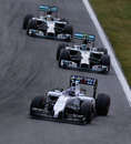 Nico Rosberg and Lewis Hamilton chase down Valtteri Bottas in the opening stint