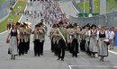 An Austrian marching band plays before the start of the race