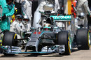 Lewis Hamilton emerges from a pit stop 