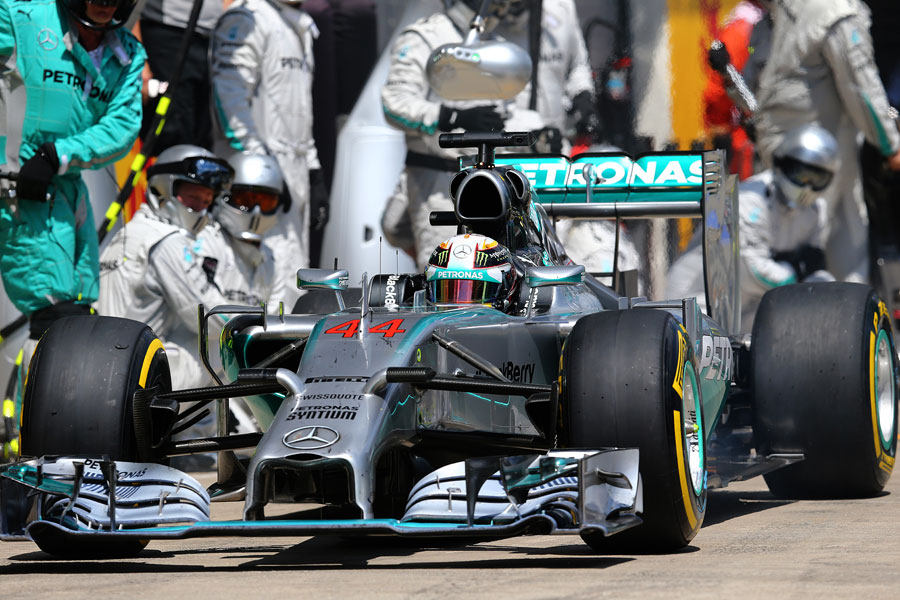Lewis Hamilton emerges from a pit stop 
