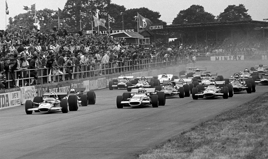 Jochen Rindt leads Jackie Stewart off the line at the start