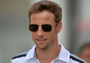 Jenson Button arrives at the Silverstone paddock on Thursday