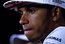 Lewis Hamilton looks on in the press conference