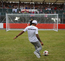 Lewis Hamilton shows off his football skills in front of a packed crowd