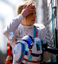 Susie Wolff walks from her stricken Williams after her debut F1 session ended after four laps