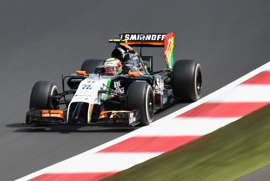 Sergio Perez approaches a kerb on Friday