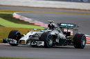 Nico Rosberg rounds the apex on the wet tyre