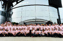 Jenson Button and the McLaren team display their pink shirts in memory of his late father John 