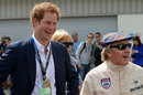 Prince Harry and Sir Jackie Stewart share a joke before the race