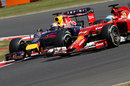 Sebastian Vettel tries to find a way past Fernando Alonso on the inside
