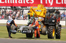 Nico Rosberg's Mercedes gets lifted away after a gearbox issue