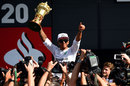 Lewis Hamilton celebrates with the RAC trophy