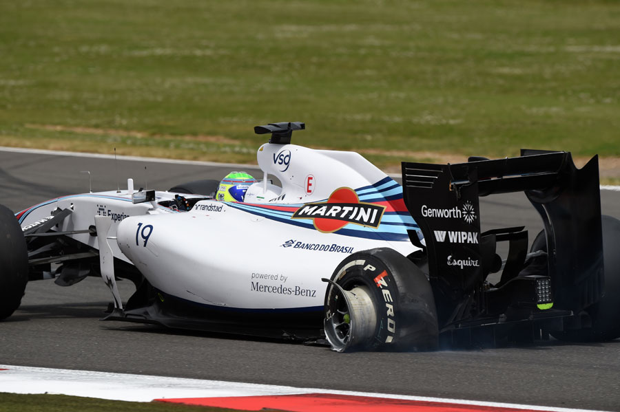 Felipe Massa limps around the circuit after being caught up in the first-lap crash