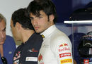 Carlos Sainz Jr looks on in the garage
