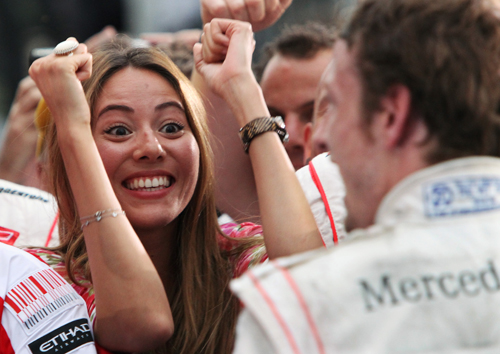 Jessica Michibata prepares to congratulate Jenson Button