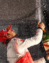 Champagne flies as Jenson Button celebrates victory