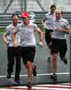 Jenson Button sprints for cover