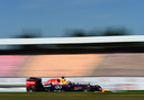 Sebastian Vettel passes empty grandstands