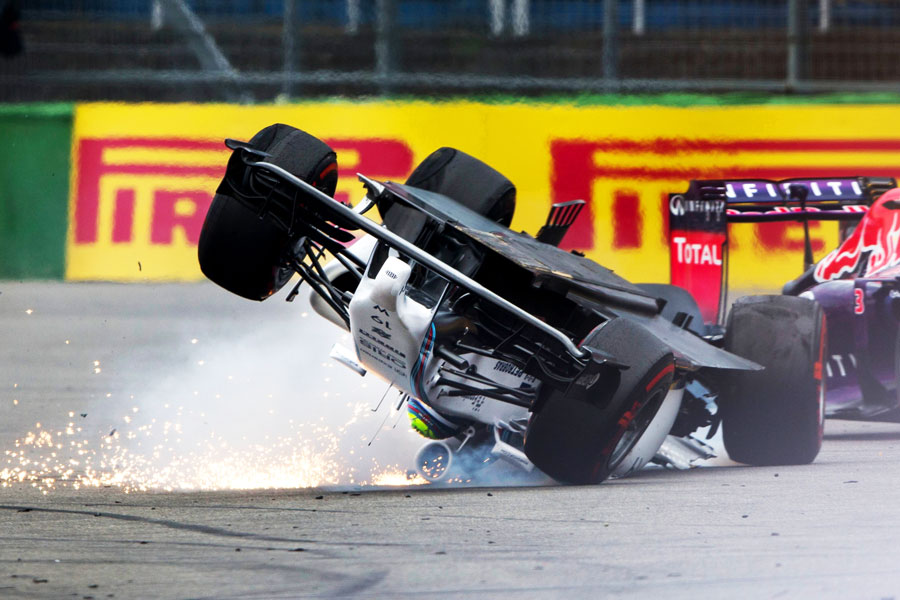 Felipe Massa gets flipped upside-down at Turn 1