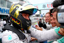 Nico Rosberg celebrates victory with his team