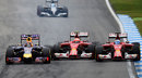Sebastian Vettel passes both Kimi Raikkonen and Fernando Alonso on the inside of Turn 6
