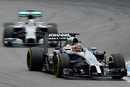 Jenson Button on track with Lewis Hamilton in close company
