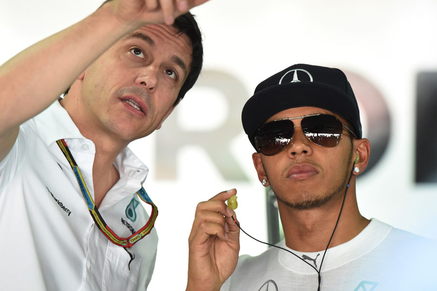 Toto Wolff and Lewis Hamilton talk in the Mercedes garage