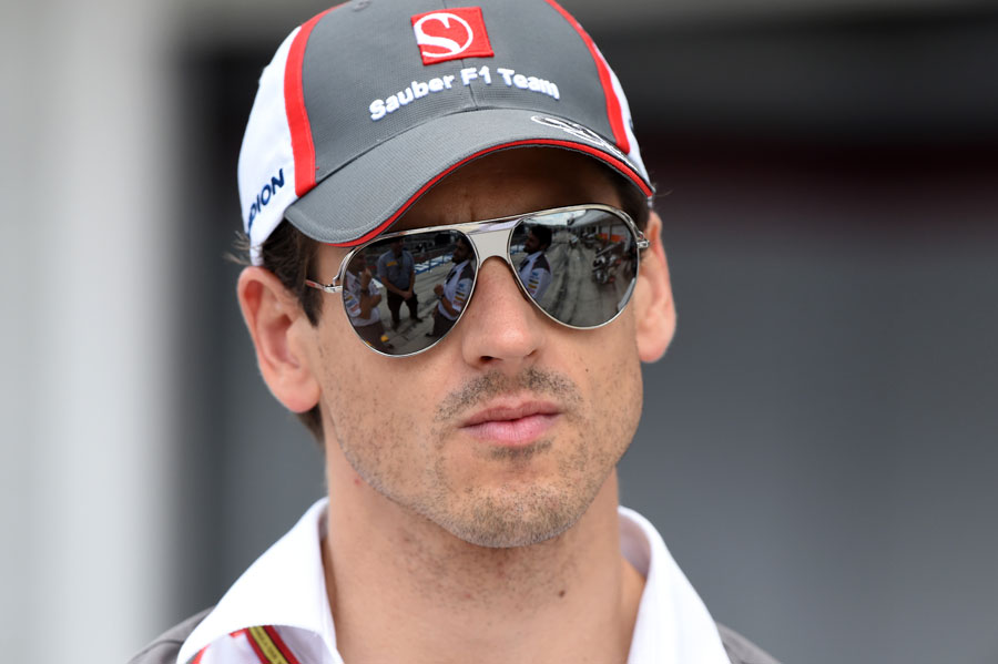 Adrian Sutil stands in the pit lane at the Hungaroring 