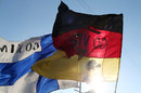 Flags of fans supporting Kimi Raikkonen and Sebastian Vettel