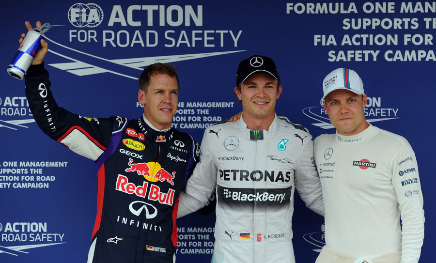 Nico Rosberg flanked by Sebastian Vettel and Valtteri Bottas in parc ferme after qualifying