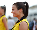 A grid girl looks on before the race