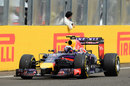 Daniel Ricciardo pumps his first in celebration as he crosses the line for the win